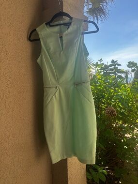 Mint Green Sleeveless Sheath Dress with Zipper Pockets Keyhole Neckline